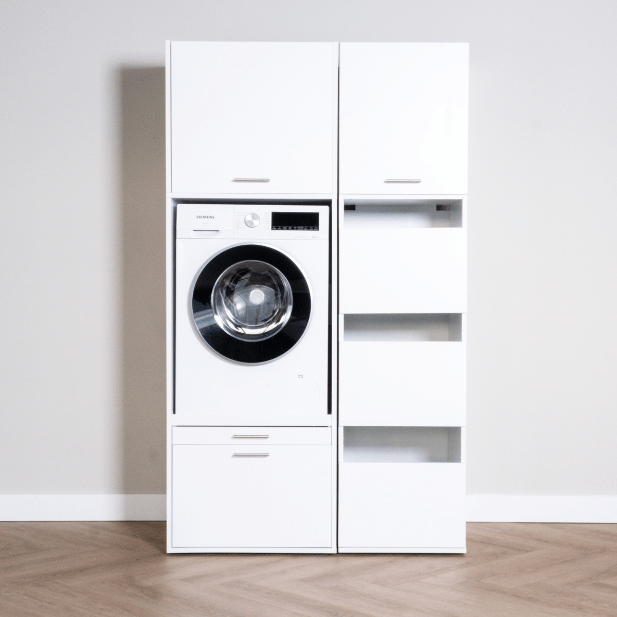 White compact washer and dryer unit paired with tall white storage cabinet, modern minimalist style.